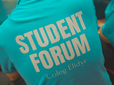 Close up of a Coleg Elidy shirt with Student Forum written on the back